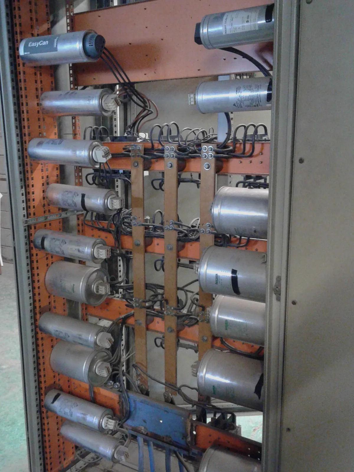 Capacitor bank inside an industrial electrical panel